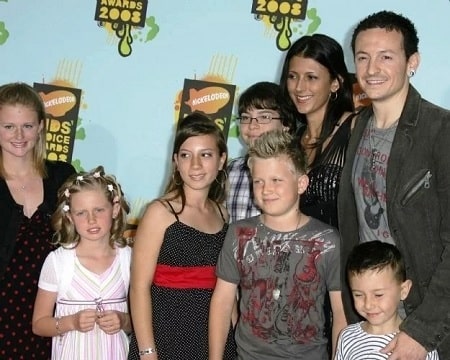 A picture of Lily with her parents and siblings.
